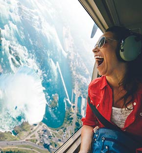 Woman in a helicopter above Niagara Falls