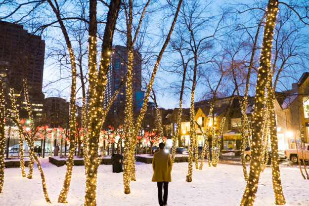 man admires Christmas lights in Toronto
