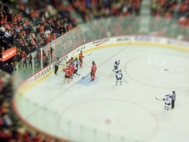 an ice hockey match in a crowded stadium