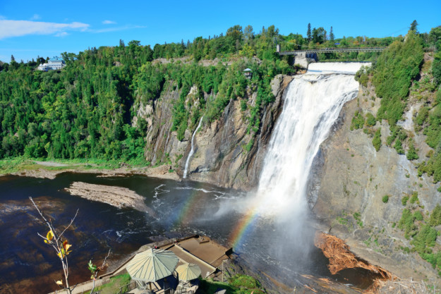 A waterfall with rainbow in the foreground