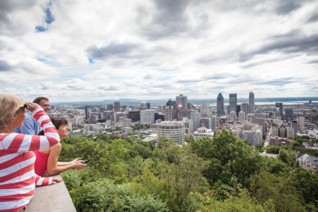 a family takes in the view of the Montreal skyline