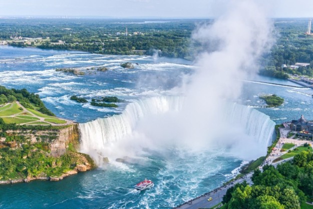 a tour boat heading towards Niagara Falls