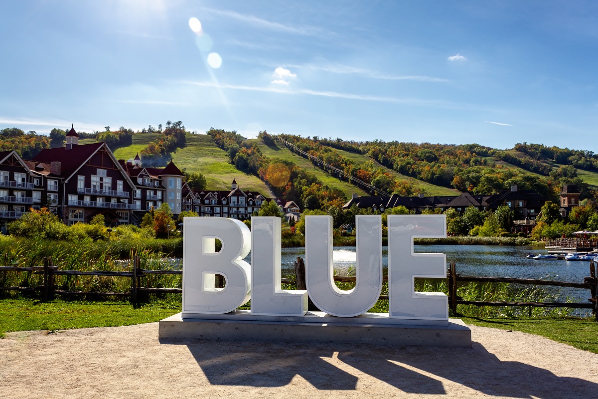 A view of Mill Pond and the Blue sign at Blue Mountain, Ontario