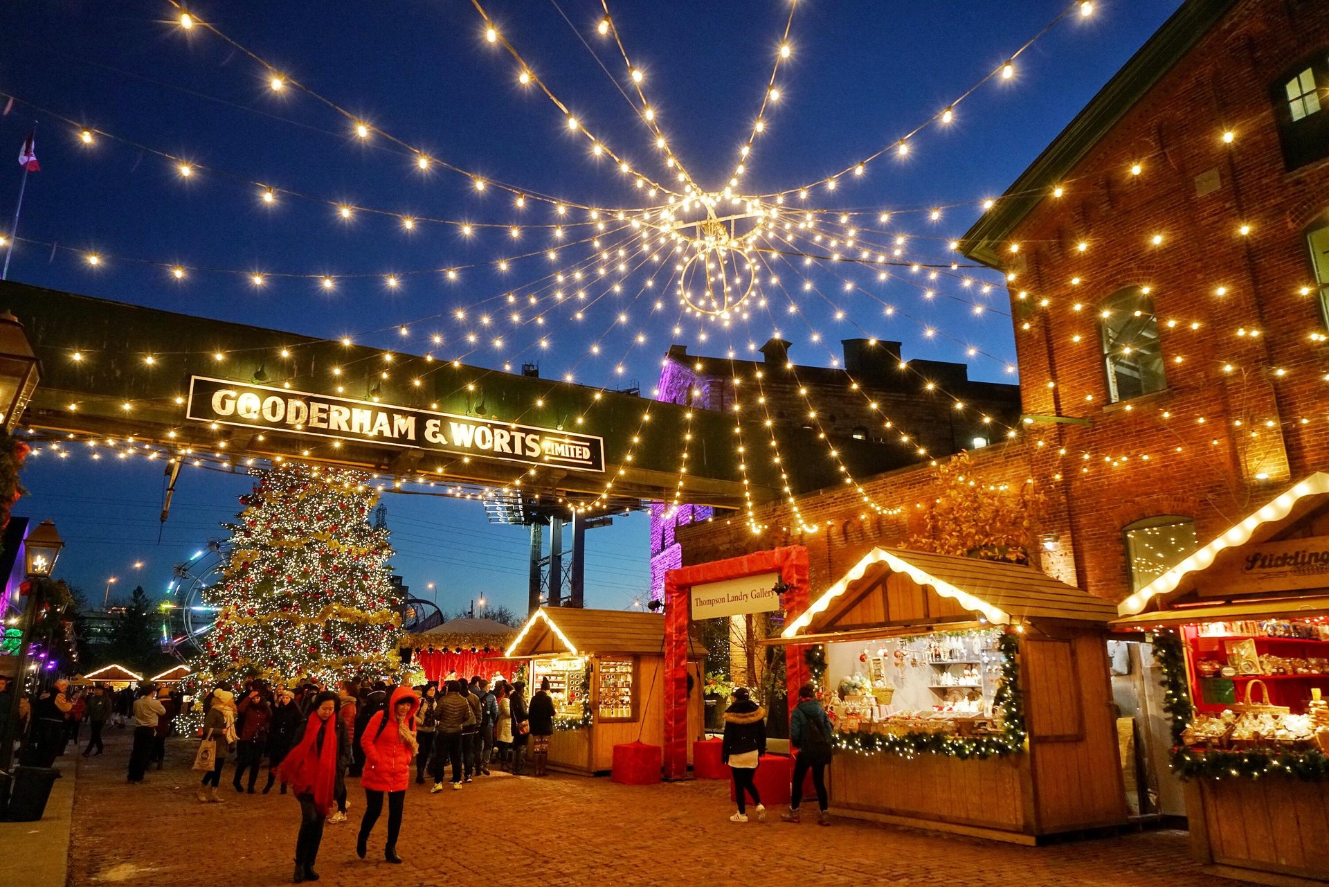 People exploring the Distillery Winter Village in Toronto
