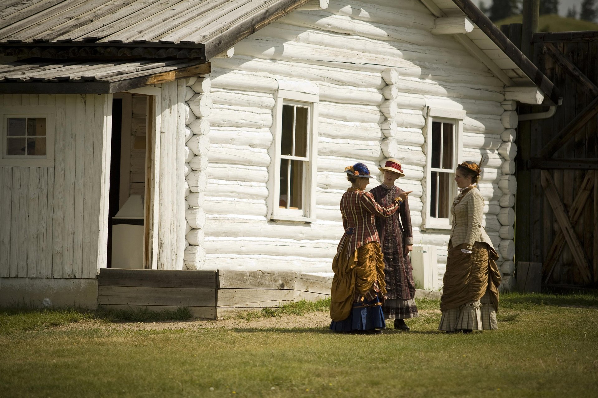 Three performing actresses at Fort Walsh National Historic Site in Saskatchewan