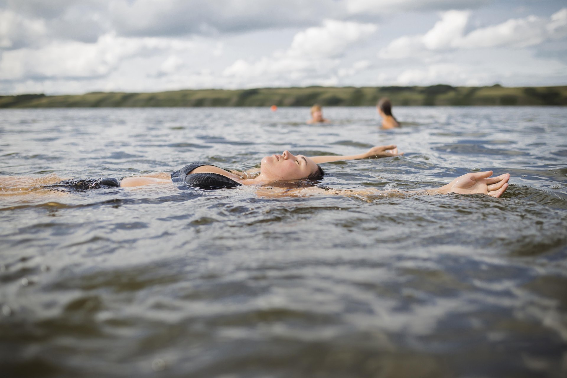 A woman floats on her back in the salty waters of Little Manitou Lake in Saskatchewan