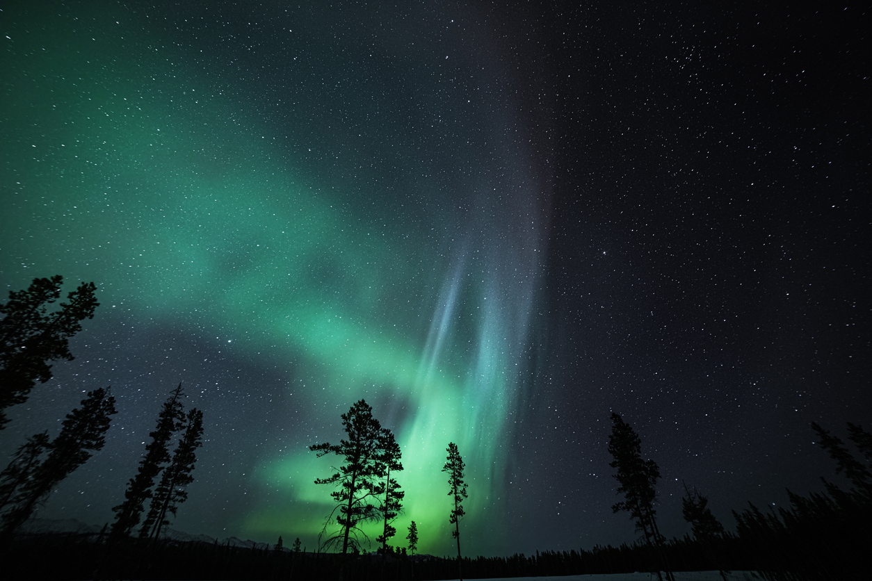 A dark night sky in Yukon and aurora borealis